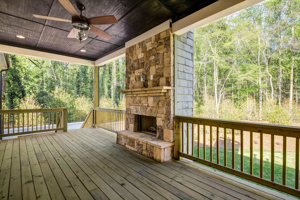 Create culinary masterpieces with an outdoor fireplace by Rockhaven Homes