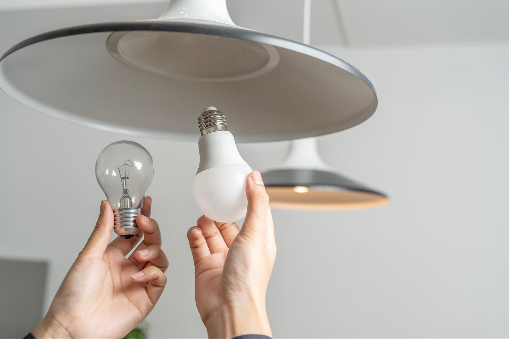 A person switching out lightbulb
©5. Switch to Energy-Efficient Lighting and Appliances
